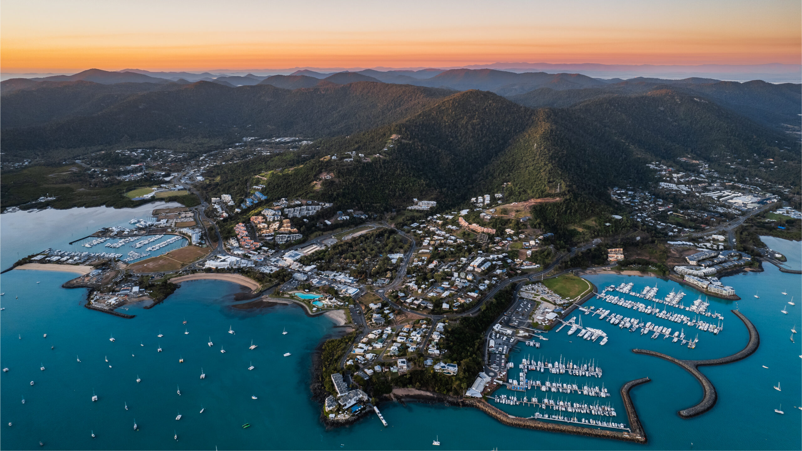 Sunrise over Airlie Summit hillside development, Airlie Beach